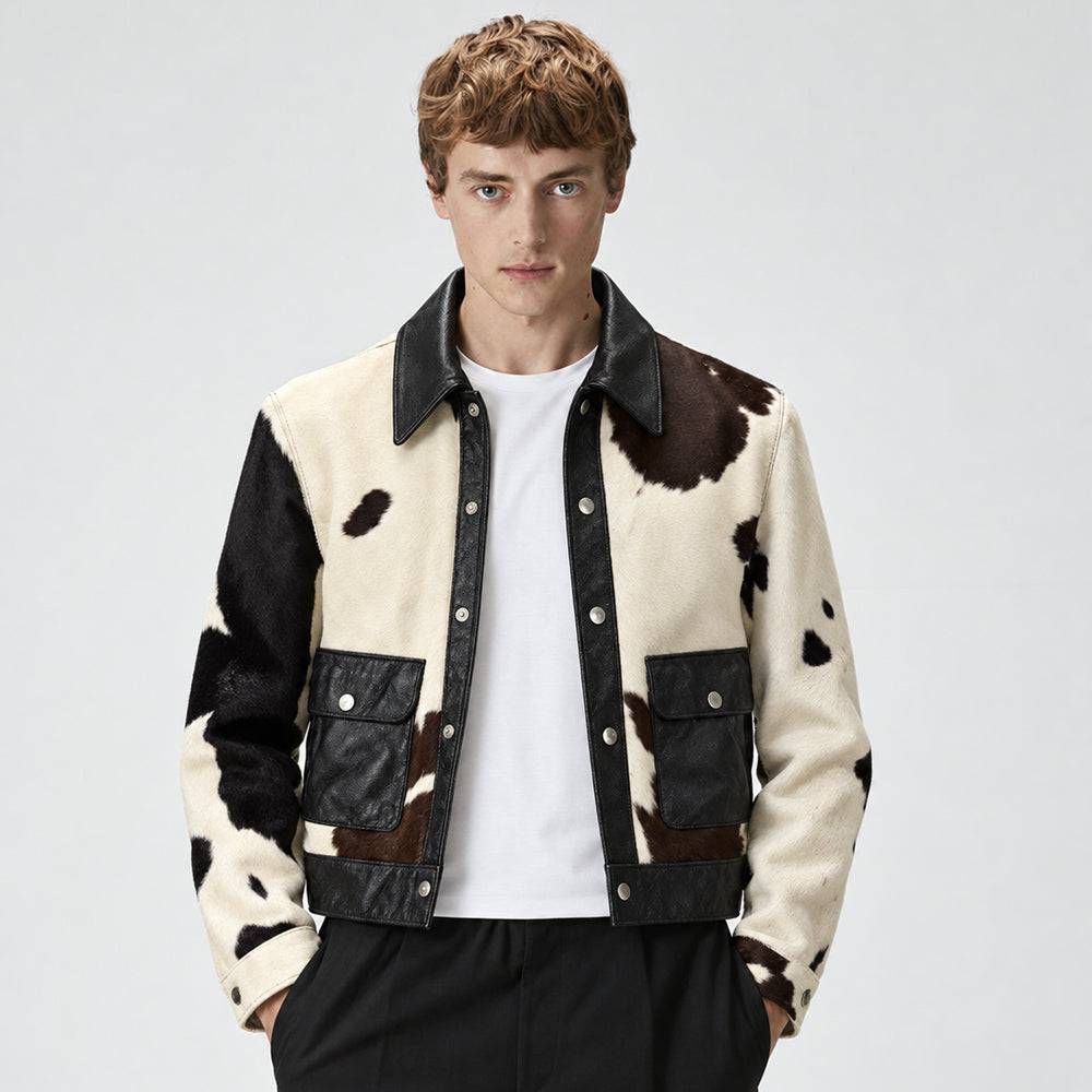 Model wearing a men’s tricolor hair-on cowhide snap jacket with espresso lambskin pockets and collar