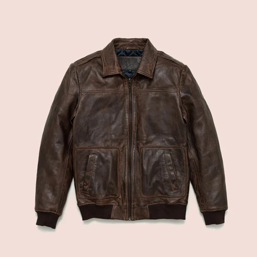 A front flat-lay view of a men's brown distressed lambskin leather bomber jacket with a YKK zip closure, snap-down collar, and side pockets.