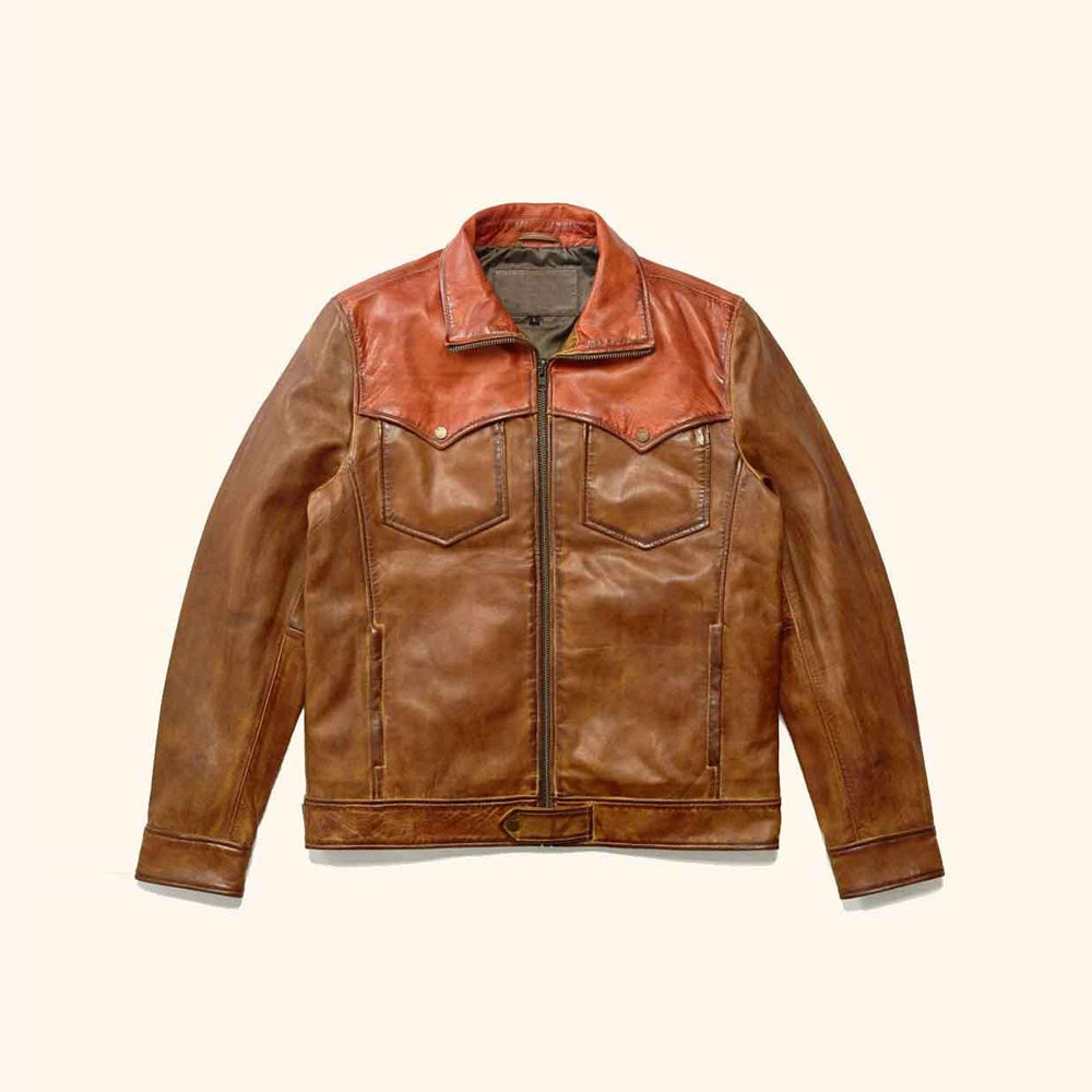 Front flat view of men’s two-tone leather trucker jacket with copper yoke, cognac body and snap-flap chest pockets