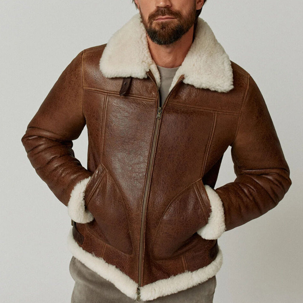 Front view of model in weathered leather B3 bomber jacket with hands in slanted handwarmer pockets