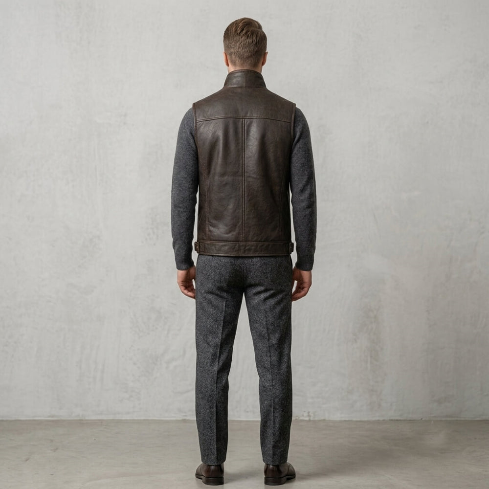 Model view from the back wearing a brown winter leather gilet, showing back panels and high collar.