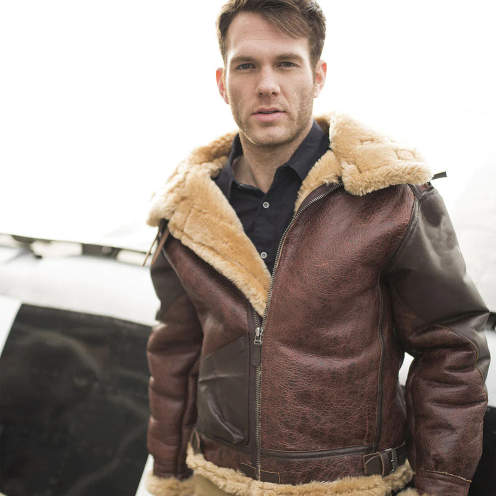 Male model outdoors wearing unzipped men's B-3 shearling flight coat in vintage brown leather with open plush fur collar