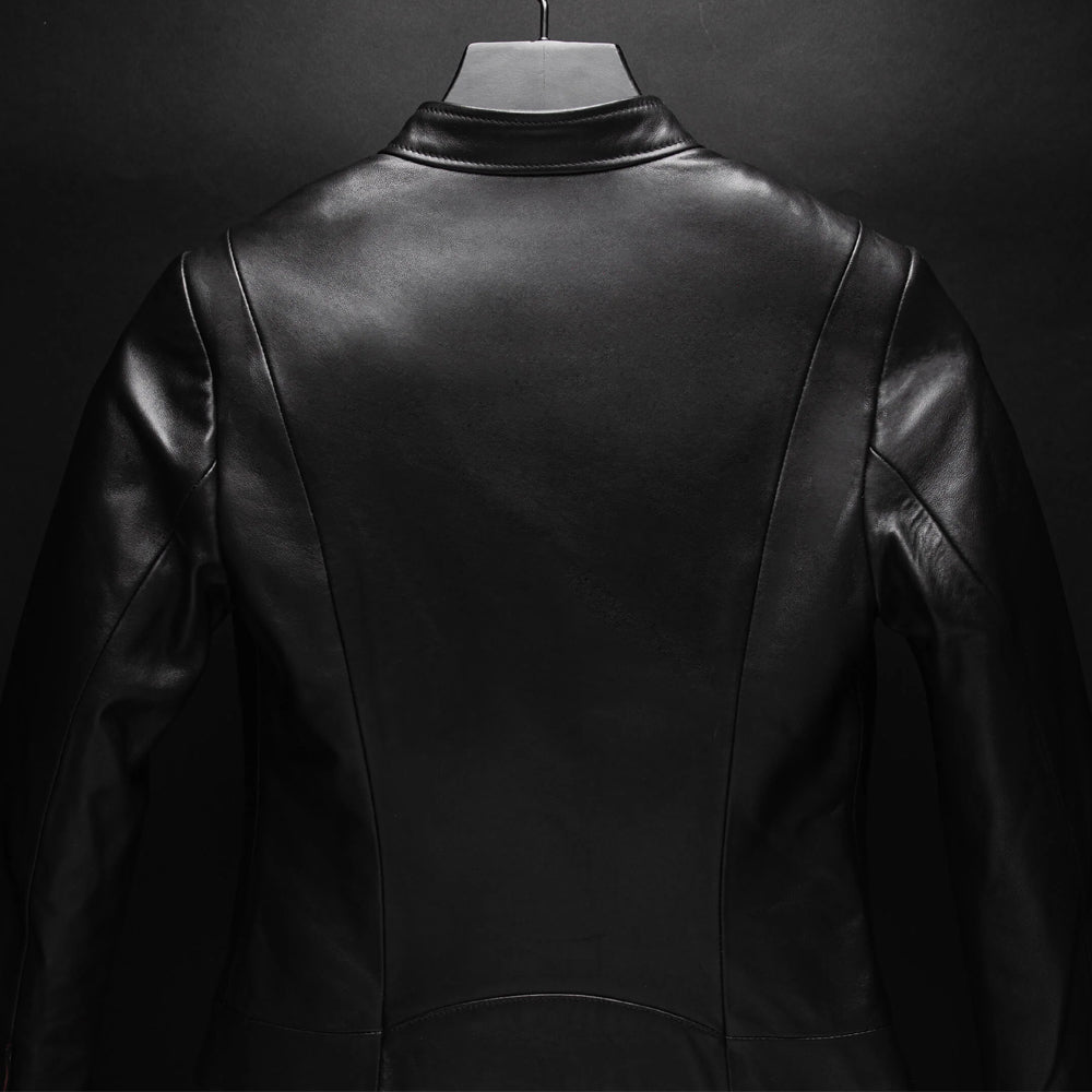 Close-up rear view of oil-black lambskin jacket with smooth center panel and shaped seams