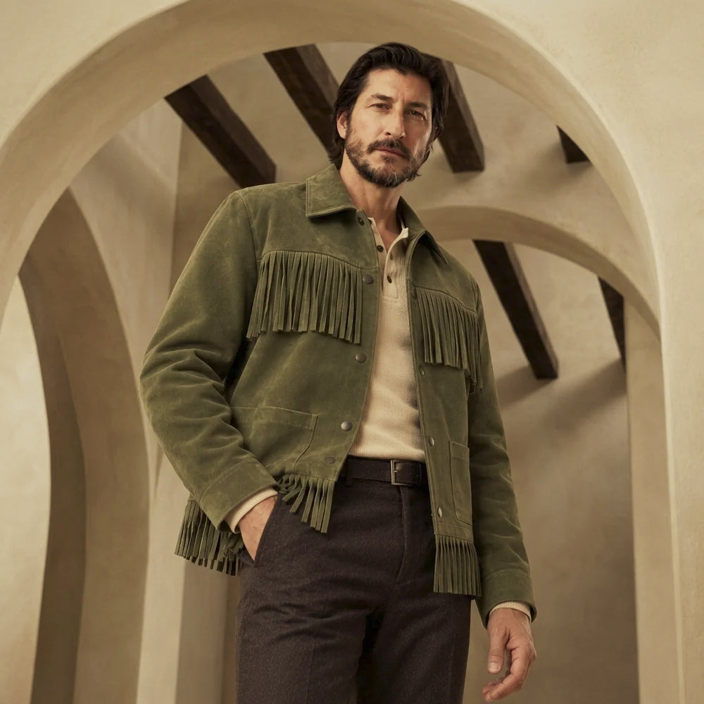 Low-angle view of olive suede cowboy jacket highlighting the layered chest fringe and hip-length ranch silhouette.