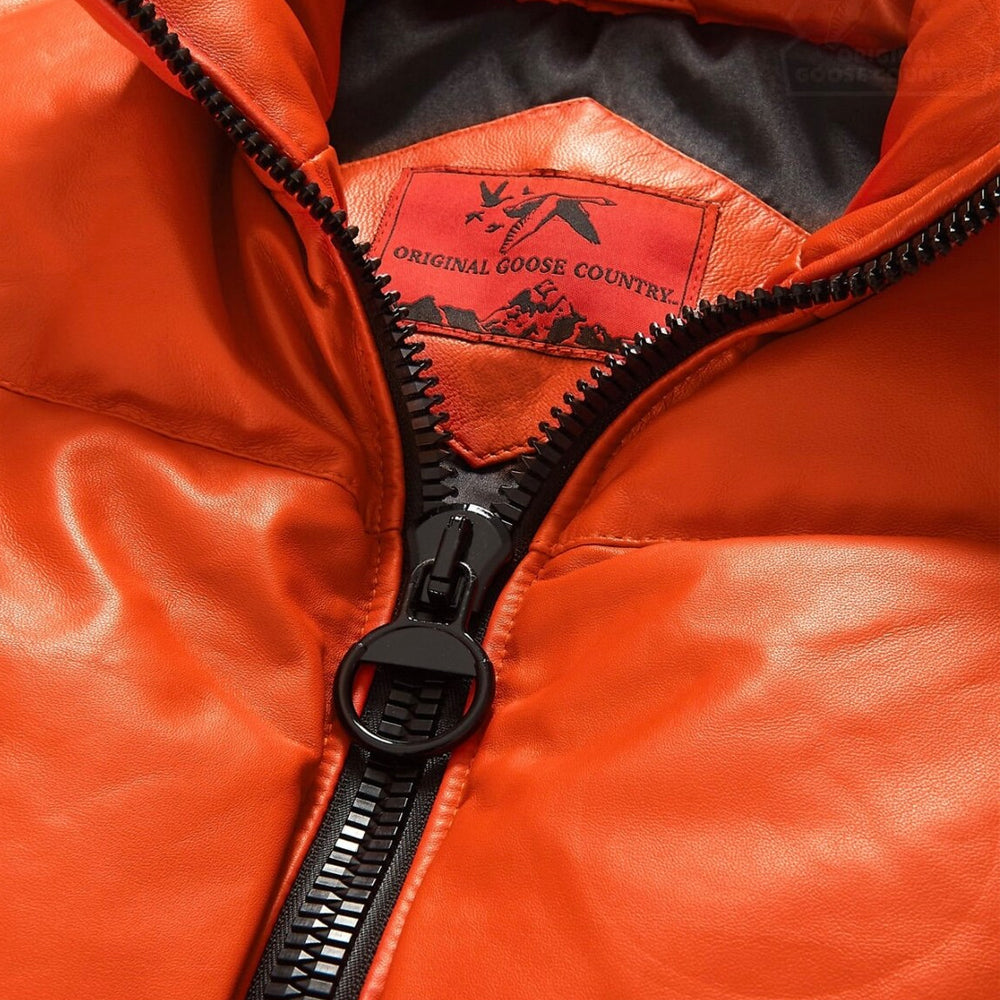 Close-up of Original Goose Country orange lambskin jacket with molded-tooth zipper, O-ring pull and interior brand label