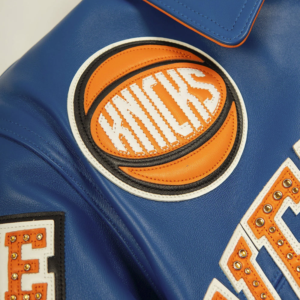 Orange black and white Knicks basketball leather patch on royal blue jacket chest