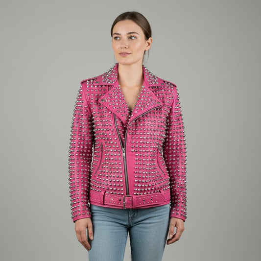 Woman wearing hot pink studded leather biker jacket with silver cone studs, front view