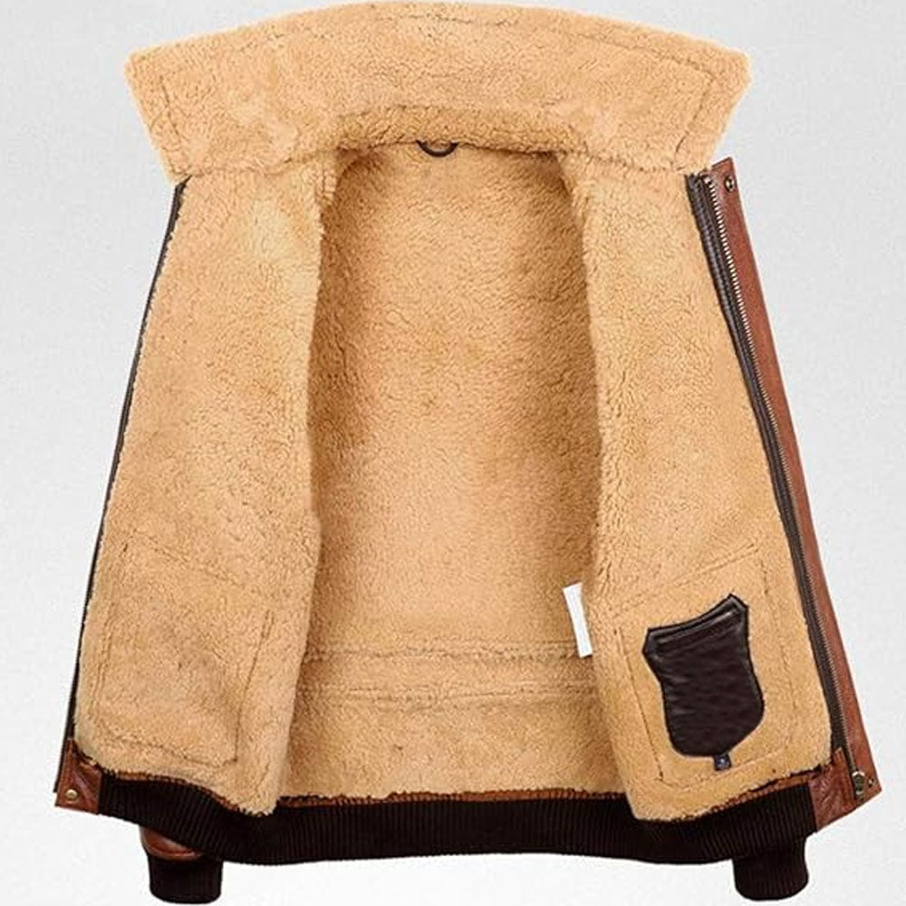 Full view of soft plush beige shearling wool interior lining inside cognac brown sheepskin jacket
