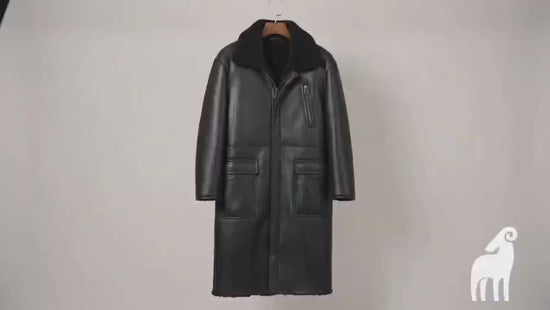 Video showcasing men's black reversible shearling leather trench coat, worn both leather-side and fur-side out