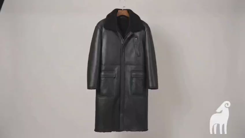 Video showcasing men's black reversible shearling leather trench coat, worn both leather-side and fur-side out