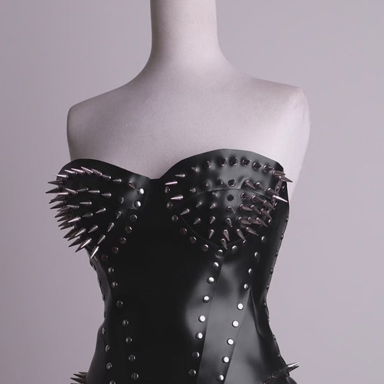 360-degree video showcase demonstrating the fit, metal bullet spikes, and back lacing of the women's gothic spiked leather overbust corset top.
