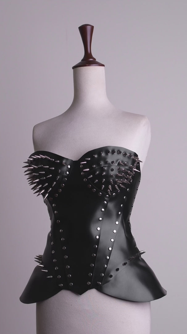360-degree video showcase demonstrating the fit, metal bullet spikes, and back lacing of the women's gothic spiked leather overbust corset top.