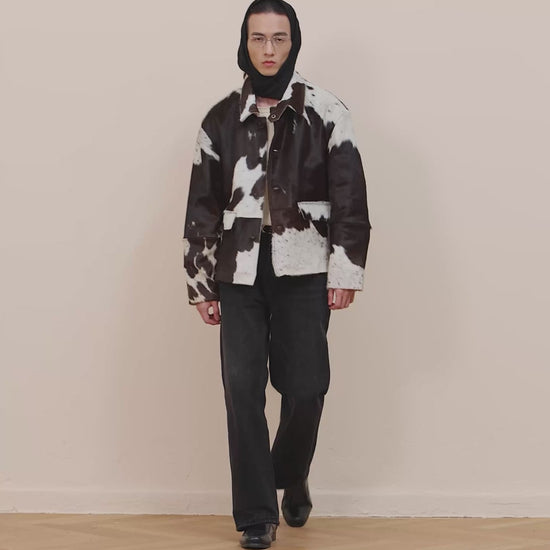 Natural leather cowhide jacket with authentic animal pattern and button details