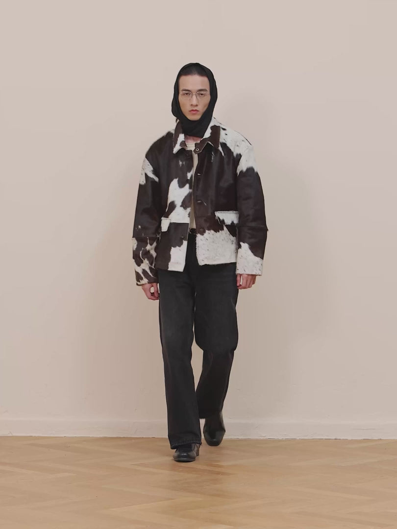 Natural leather cowhide jacket with authentic animal pattern and button details