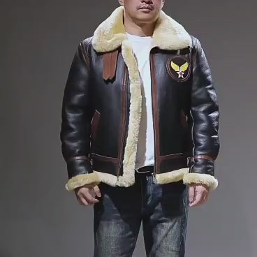 Product video showcase of model wearing men's black B3 shearling aviator jacket demonstrating fit, USAAF patch, and collar buckles