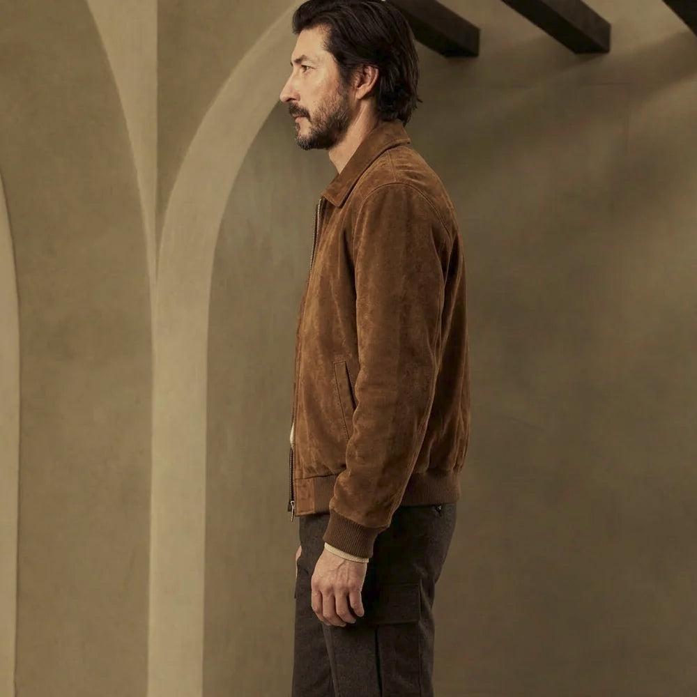 Full side view of regular-fit suede bomber jacket with point collar, waist-length body and tonal sleeve panel stitching.