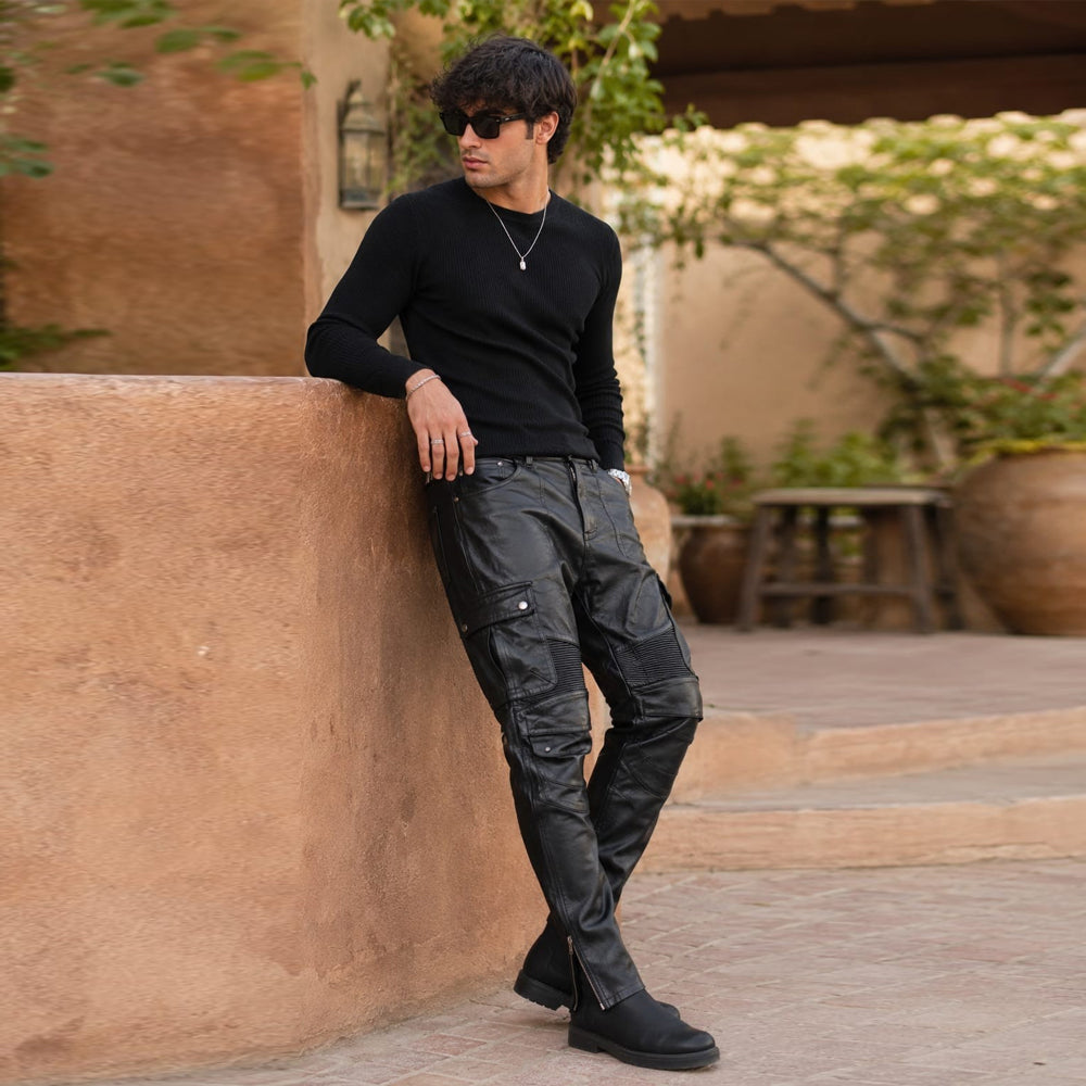 Side view showing tactical cargo pockets on premium black lambskin biker trousers.