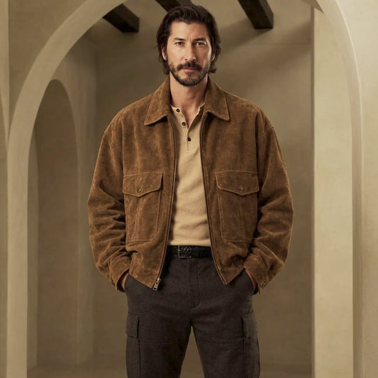 Front view of tobacco suede trucker jacket for men with oversized fit, point collar, antique zipper and twin snap-flap chest pockets.
