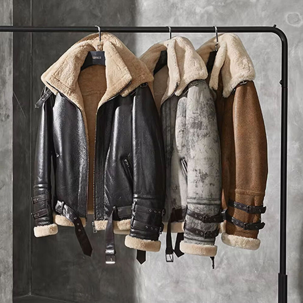 Rack display of vintage B3 shearling bomber jackets showcasing color variations and fur trims