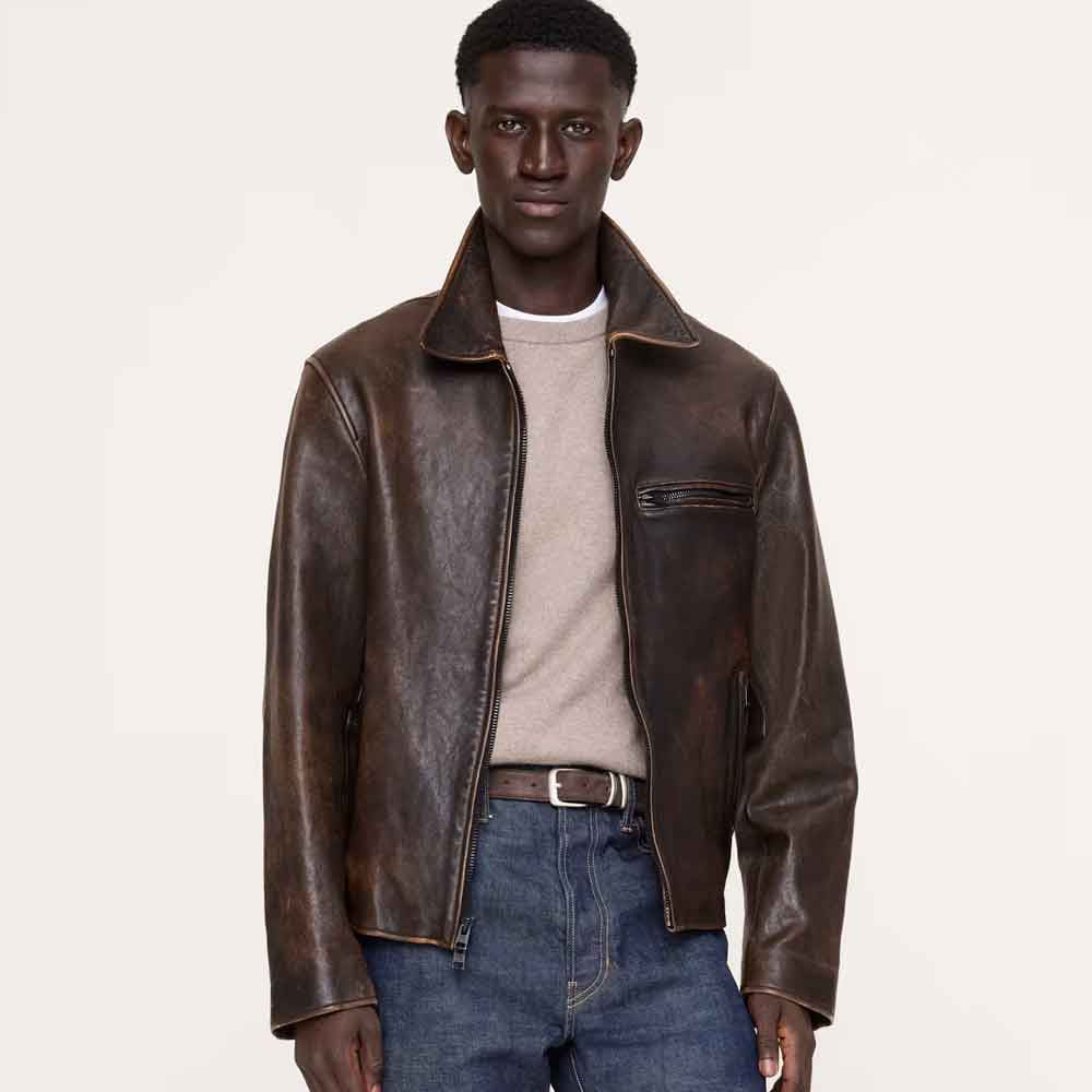 Model wearing waxed cowhide racer jacket with close waist-length fit, open point collar and distressed brown finish
