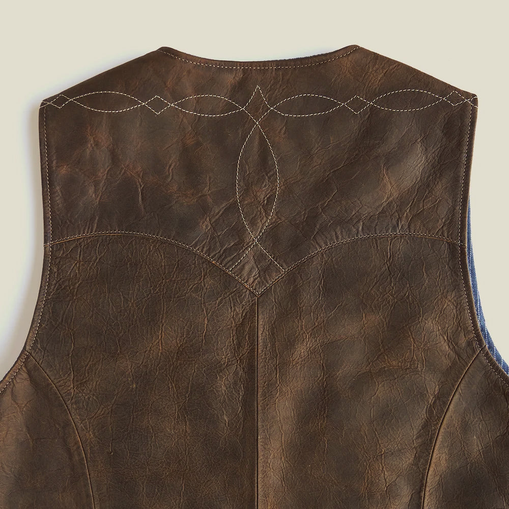 Full leather rear yoke featuring symmetrical scroll stitching, diamond points and a curved center drop
