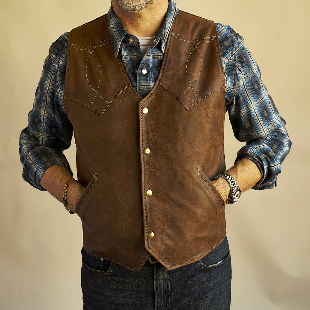 Men’s Western bison leather vest with hands resting inside the two angled welt handwarmer pockets