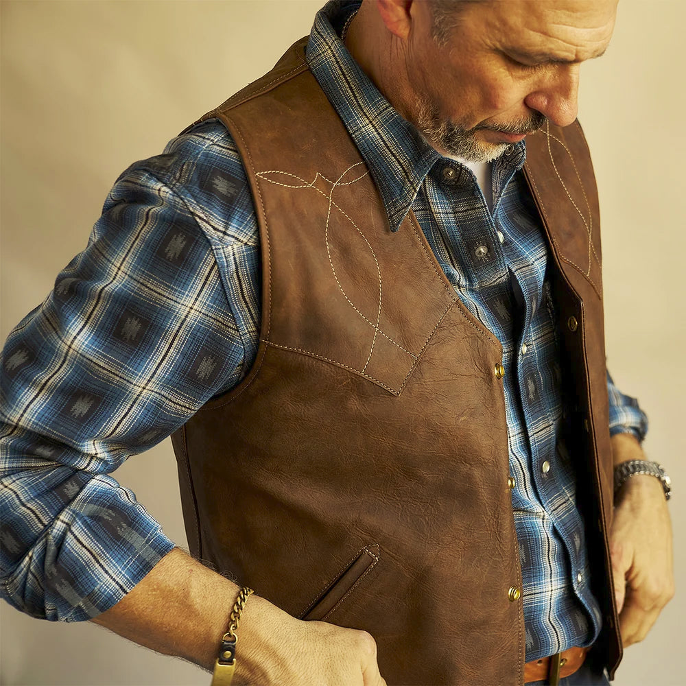 Close view of contrast diamond-and-leaf scroll stitching across the brown bison leather front yoke