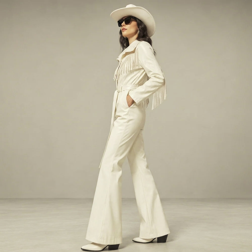 Profile of a women’s white fringe leather jumpsuit showing the long sleeves, hip pocket and flared pants.