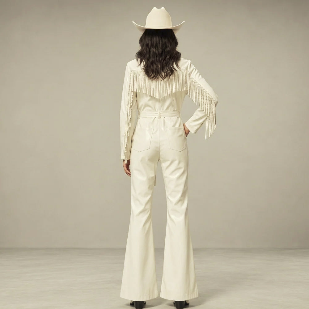 Back view of a white cowgirl leather jumpsuit with shoulder-yoke fringe, sleeve trim, waist loops and two rear patch pockets.
