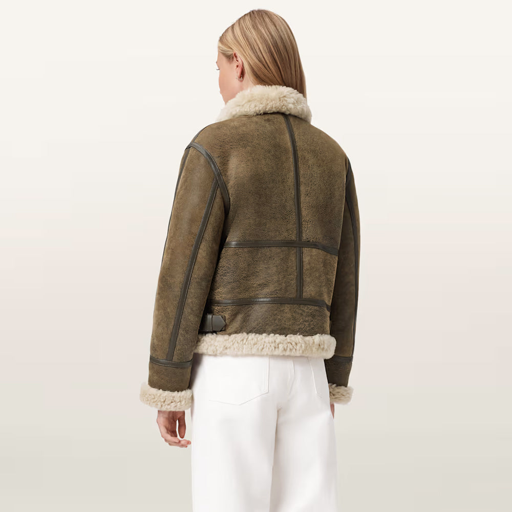 Rear profile of women's B-3 shearling aviator jacket showing grid seam piping across back.