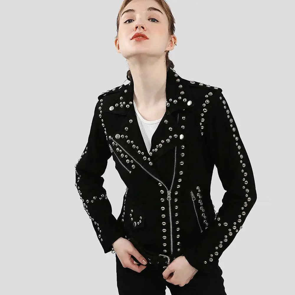 Woman wearing a black studded suede leather jacket with silver hardware