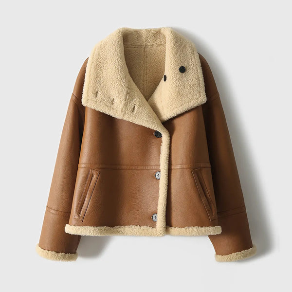 Front view of a woman's brown reversible sheepskin leather jacket with an oversized shearling collar.