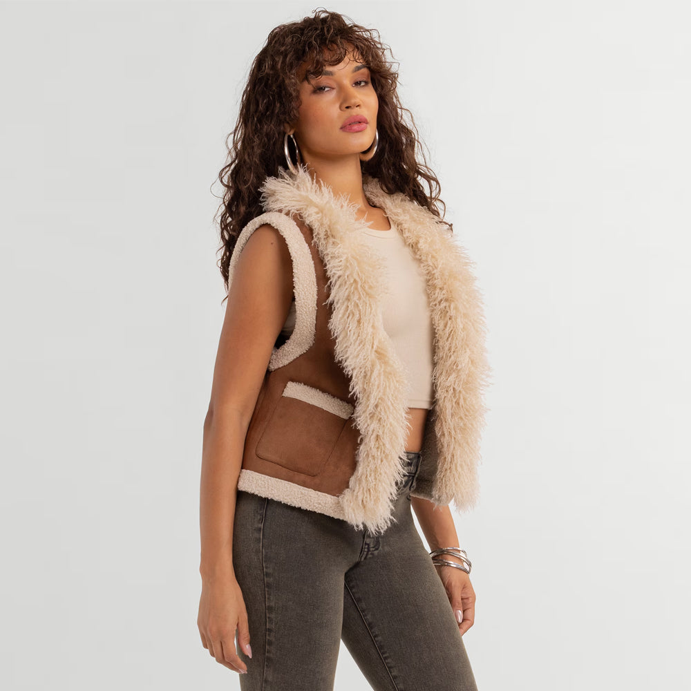Angled view of women’s camel suede gilet with long-pile ivory facing and short fur armhole edging