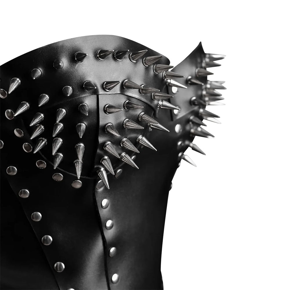 Macro close-up detail of silver bullet cone spikes on sweetheart bust cups of overbust leather corset.