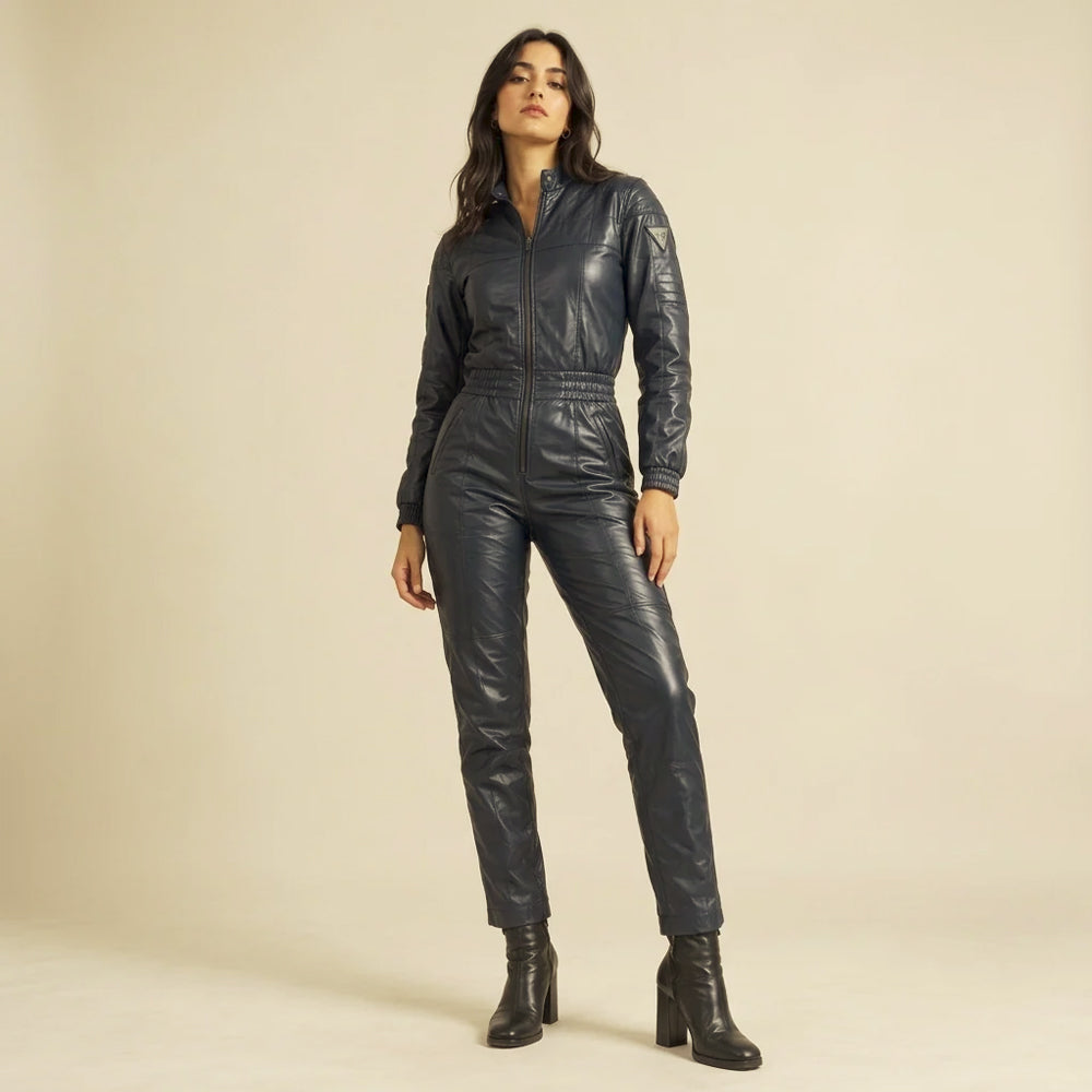 Women's navy leather moto jumpsuit with a stand collar, quilted shoulders, gathered waist and tapered legs.