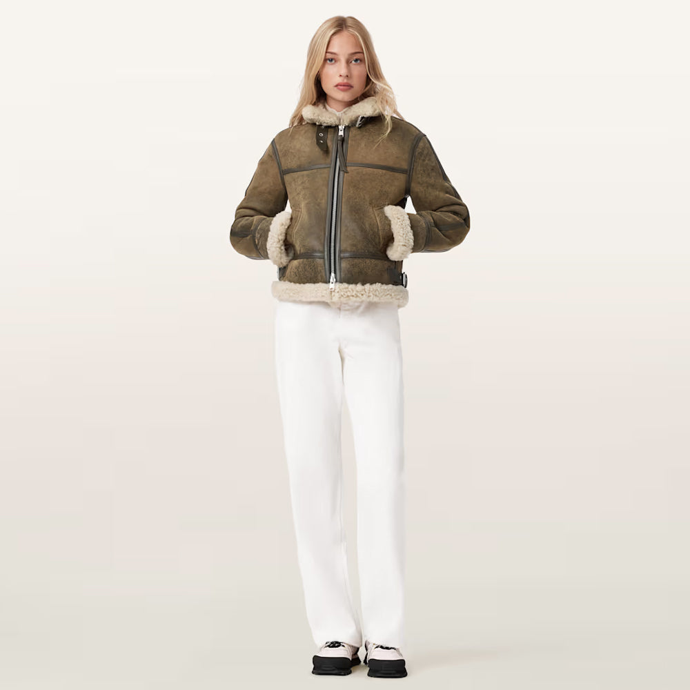 Model wearing zipped-up olive brown women's B3 aviator bomber coat with high collar.