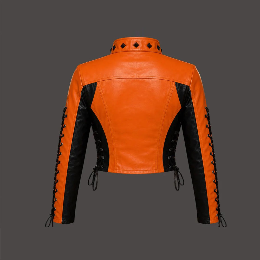 Rear view of women’s cropped orange and black leather jacket with angular panels and lace-up sides