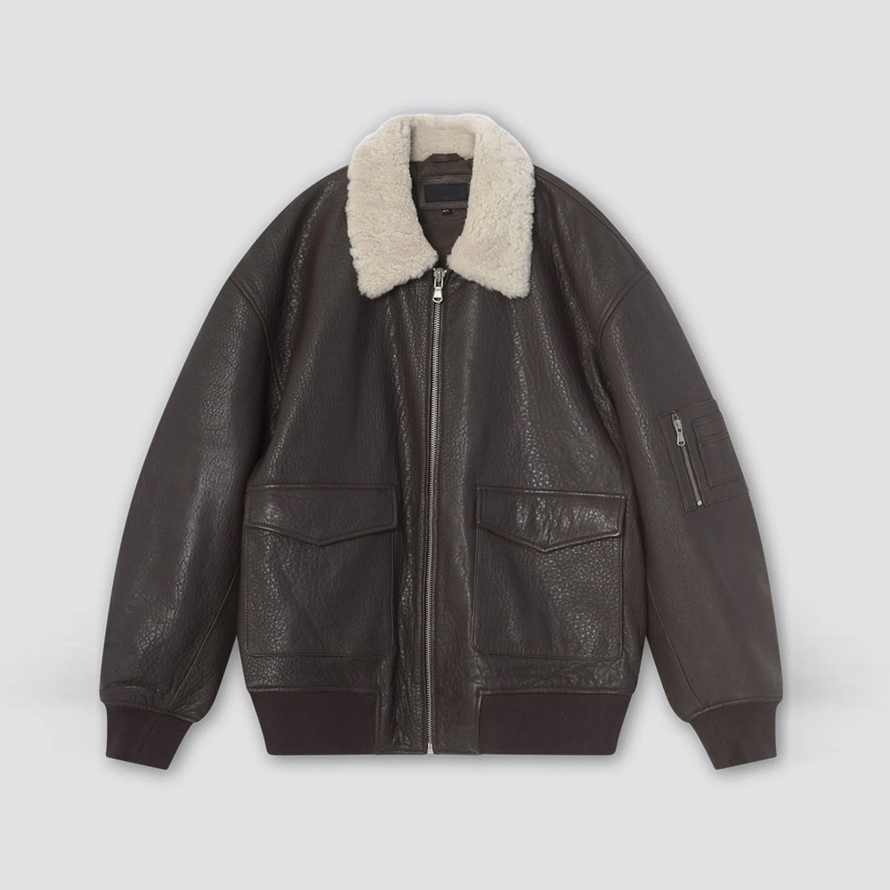 Flat front view of women's oversized brown leather bomber jacket with shearling collar and sleeve zip pocket
