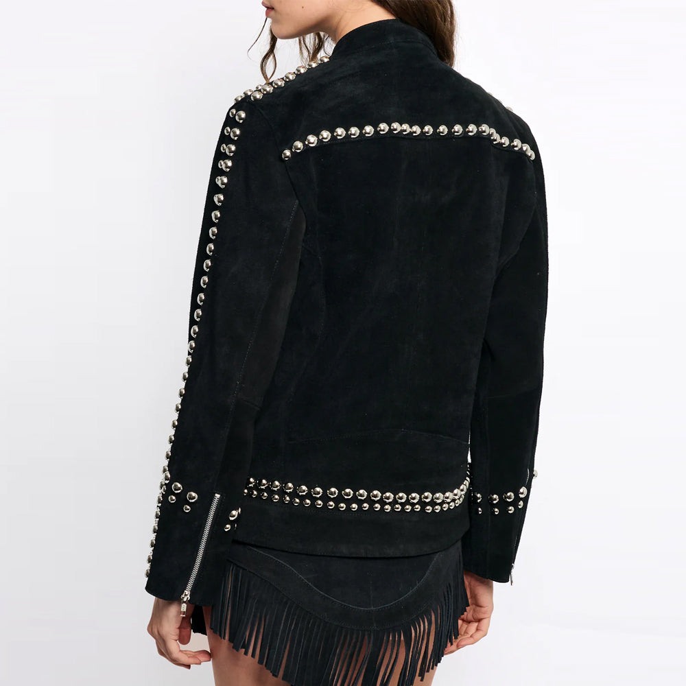 Rear view of a model wearing the black suede racer jacket, highlighting the hand-hammered silver studs on the back hem.