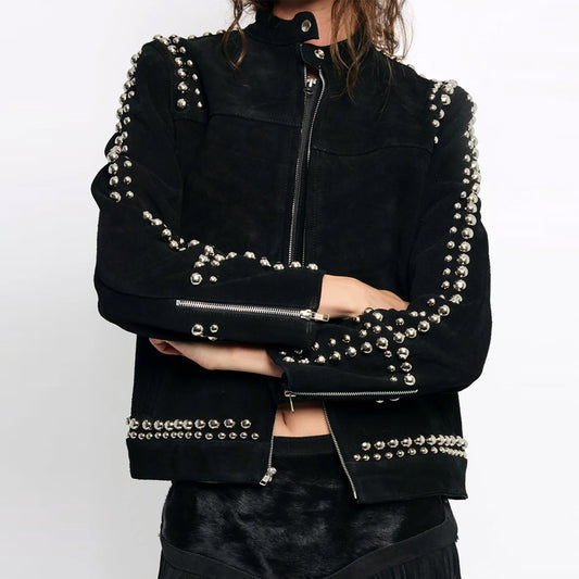 Front view of a female model wearing the oversized black suede Studded Looker Jacket with silver studs.