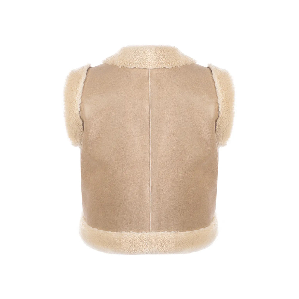 Studio rear of women’s tan shearling vest showing a clean center-seamed suede back