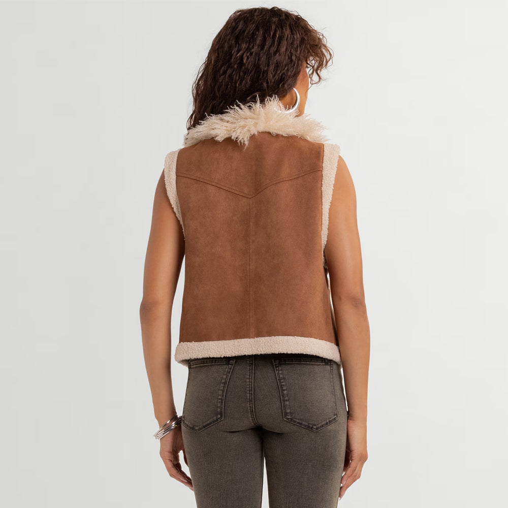 Back view of women’s tan suede plush vest showing cream hem trim, center seam and Western chevron yoke