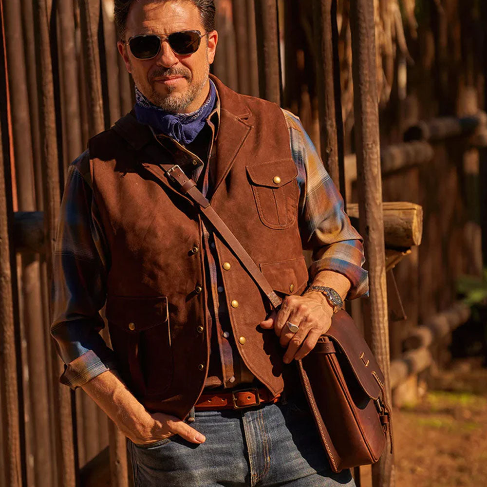 Front lifestyle view of a man showcasing the fit of the brown vest.