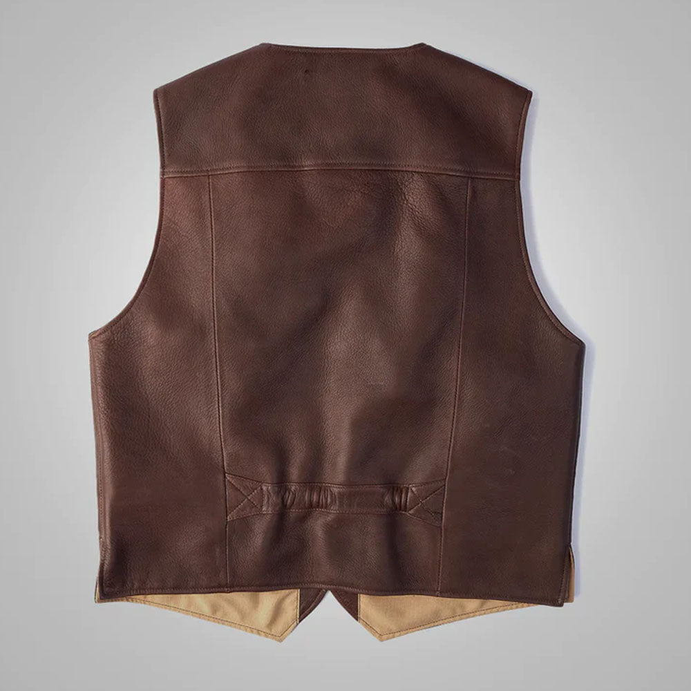 Rear view of the brown buckskin leather utility waistcoat highlighting the clean leather back panel and reinforced lower adjustment strap.