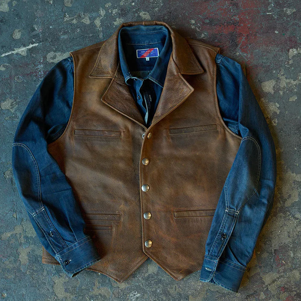 Front view of the brown sheepskin leather cowboy vest styled over a classic blue button-down shirt.