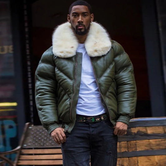 A model standing in the street wearing the men's money green lambskin leather V-bomber jacket in a full front view pose.