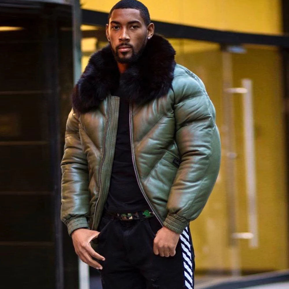 Front view of a man on the street wearing an olive-green leather winter bomber jacket, styled completely open and unzipped.