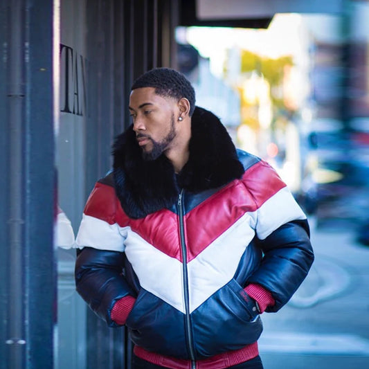 Front view of a man on the street wearing the tri-color leather V-bomber jacket completely zipped up with hands inside the pockets.