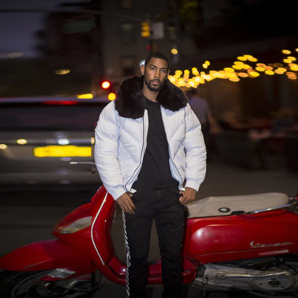 A model wearing the premium white leather V-bomber down puffer coat open in an urban street setting.