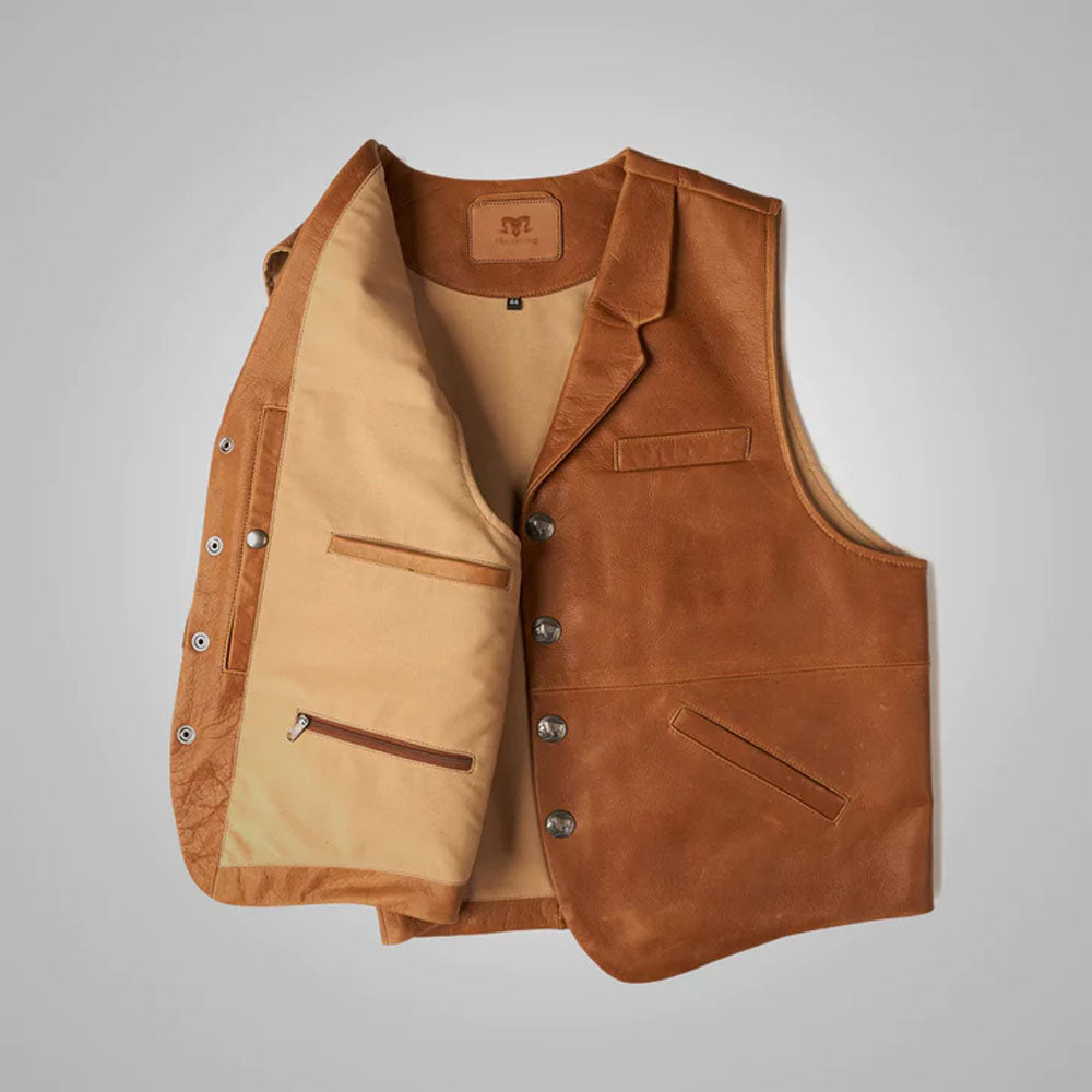 Inside view of the brown leather cowboy vest, highlighting the open welt pocket and secure lower zippered internal pocket.